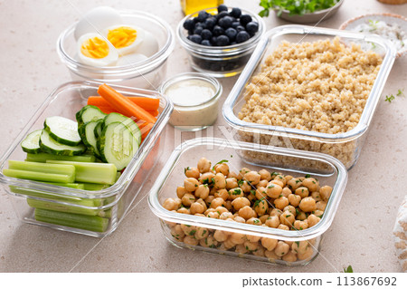 Vegetarian lunch meal prep in containers, high protein with quinoa, herbed chickpeas, vegetables and boiled eggs Vegetarian lunch meal prep in containers, high protein with quinoa, herbed chickpeas, vegetables and boiled eggs 113867692