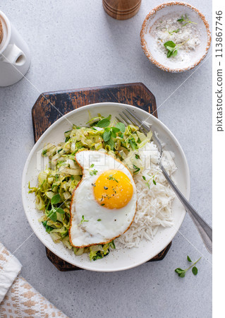 Rice bowl with sauteed cabbage and fried egg, healthy lunch or breakfast idea Rice bowl with sauteed cabbage and fried egg, healthy lunch or breakfast idea 113867746
