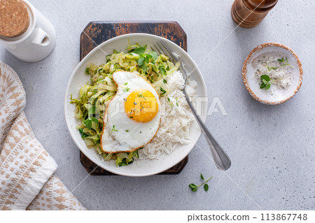 Rice bowl with sauteed cabbage and fried egg, healthy lunch or breakfast idea Rice bowl with sauteed cabbage and fried egg, healthy lunch or breakfast idea 113867748