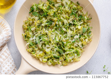 Sauteed green cabbage or lettuce, healthy side dish idea 113867752