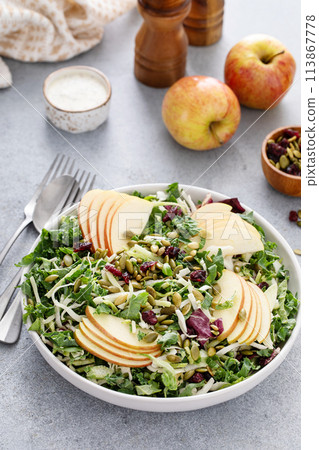 Healthy kale and cabbage mix salad with apples and pumpkin seeds 113867778