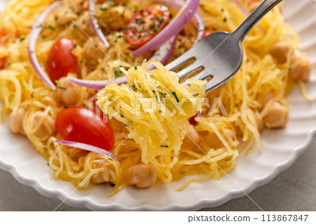 Spaghetti squash with chickpeas and tomatoes topped with red onion, low carb vegan recipe idea Spaghetti squash with chickpeas and tomatoes topped with red onion, low carb vegan recipe idea 113867847