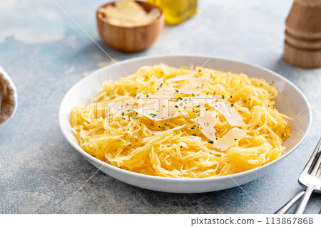 Spaghetti squash roasted and pulled apart served with olive oil and parmesan Spaghetti squash roasted and pulled apart served with olive oil and parmesan 113867868