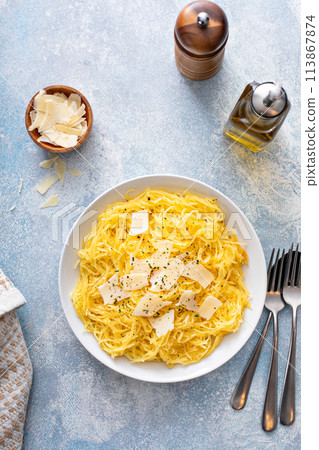 Spaghetti squash roasted and pulled apart served with olive oil and parmesan Spaghetti squash roasted and pulled apart served with olive oil and parmesan 113867874