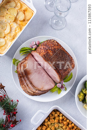 Holiday dinner with honey glazed spiral cut ham and all the sides Holiday dinner with honey glazed spiral cut ham and all the sides 113867893
