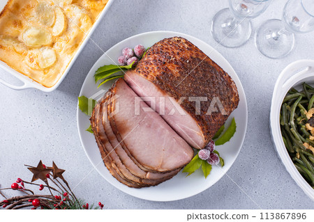 Holiday dinner with honey glazed spiral cut ham and all the sides 113867896