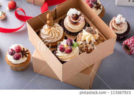 Variety of Christmas cupcakes in a gift box 113867923