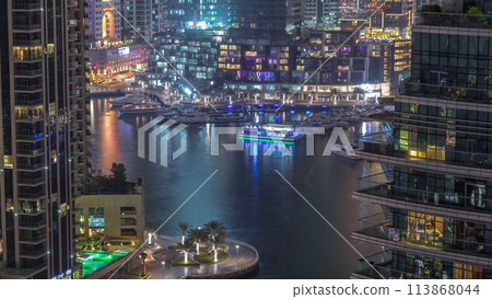 Waterfront promenade in Dubai Marina aerial night timelapse. Dubai, United Arab Emirates 113868044