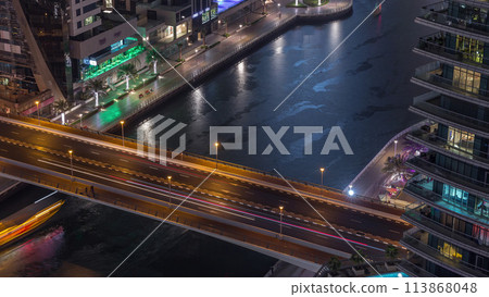 Waterfront promenade in Dubai Marina aerial night timelapse. Dubai, United Arab Emirates 113868048