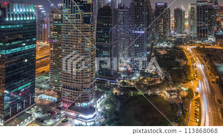 Jumeirah Lake Towers residential district aerial night timelapse near Dubai Marina 113868068