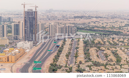 Aerial view of apartment houses and villas in Dubai city timelapse, United Arab Emirates Aerial view of apartment houses and villas in Dubai city timelapse, United Arab Emirates 113868069
