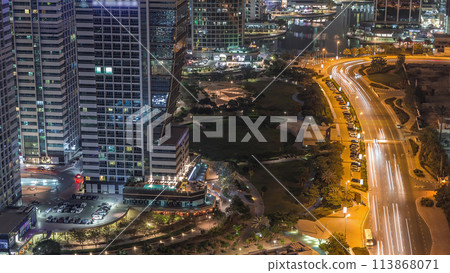 Jumeirah Lake Towers residential district aerial night timelapse near Dubai Marina Jumeirah Lake Towers residential district aerial night timelapse near Dubai Marina 113868071