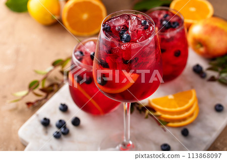 Winter orange and berry sangria with sliced oranges and blueberries Winter orange and berry sangria with sliced oranges and blueberries 113868097