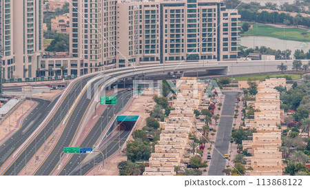 Aerial view of apartment houses and villas in Dubai city timelapse, United Arab Emirates Aerial view of apartment houses and villas in Dubai city timelapse, United Arab Emirates 113868122