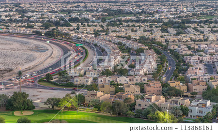 Aerial view to villas and houses with Golf course day to night timelapse Aerial view to villas and houses with Golf course day to night timelapse 113868161