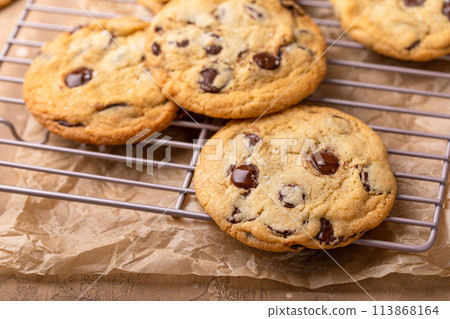 Chocolate chip cookies freshly baked on a cooling rack 113868164