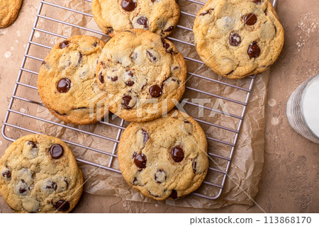 Chocolate chip cookies freshly baked on a cooling rack 113868170