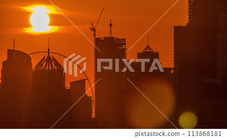 Dubai Marina skyscrapers from golf course sunset timelapse, Dubai, United Arab Emirates 113868181
