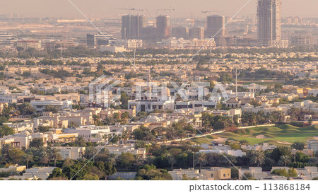 Aerial view to villas and houses near Golf course with lakes timelapse. Aerial view to villas and houses near Golf course with lakes timelapse. 113868184