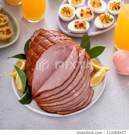 Traditional Easter ham on the table served with brunch 113868477