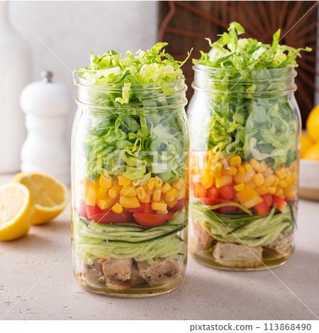 Salad meal prep in a jar, vegetables and corn salad with chicken 113868490