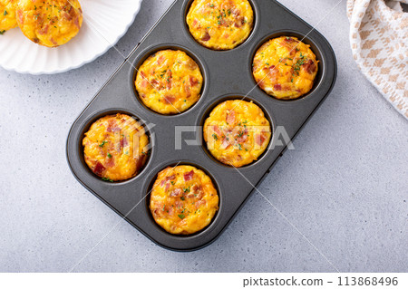 Breakfast egg muffins or egg bites with bacon and cheddar Breakfast egg muffins or egg bites with bacon and cheddar 113868496