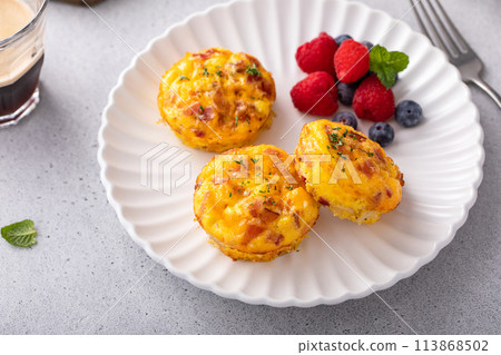 Breakfast egg muffins or egg bites with bacon and cheddar Breakfast egg muffins or egg bites with bacon and cheddar 113868502
