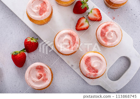 Strawberry lemonade cupcakes with a swirl of cream cheese frosting Strawberry lemonade cupcakes with a swirl of cream cheese frosting 113868745