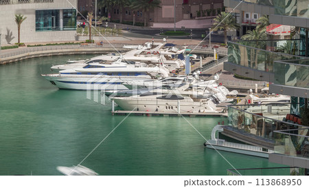 Waterfront promenade in Dubai Marina aerial timelapse. Dubai, United Arab Emirates 113868950