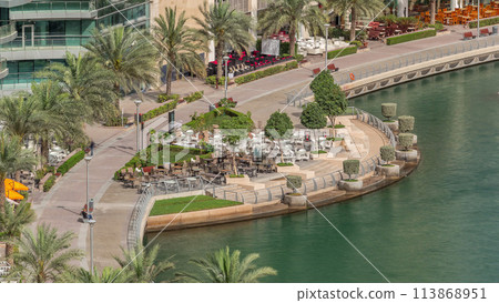 Waterfront promenade in Dubai Marina aerial timelapse. Dubai, United Arab Emirates 113868951