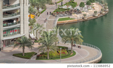 Waterfront promenade in Dubai Marina aerial timelapse. Dubai, United Arab Emirates 113868952