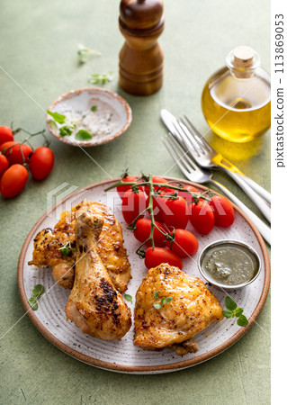 Roasted lemon and herb chicken drumsticks and thighs Roasted lemon and herb chicken drumsticks and thighs 113869053