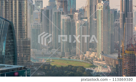 Dubai downtown during golden sunrise morning scene timelapse. Dubai downtown during golden sunrise morning scene timelapse. 113869380