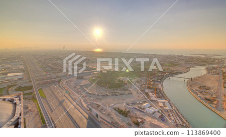 Panorama and aerial view of coastline Dubai at sunset timelapse, United Arab Emirates Panorama and aerial view of coastline Dubai at sunset timelapse, United Arab Emirates 113869400