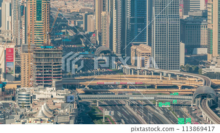 Skyscrapers on Sheikh Zayed Road and DIFC aerial timelapse in Dubai, UAE. 113869417