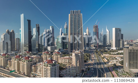 Skyline view of the buildings of Sheikh Zayed Road and DIFC timelapse in Dubai, UAE. 113869426