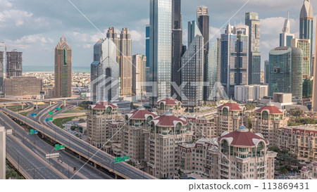 Aerial view of skyscrapers and road junction in Dubai timelapse 113869431