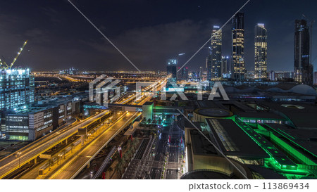 Aerial view of Financial center road night to day timelapse with under construction building 113869434