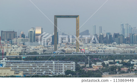 Skyline view of Deira and Sharjah districts in Dubai day to night timelapse after sunset, UAE. Skyline view of Deira and Sharjah districts in Dubai day to night timelapse after sunset, UAE. 113869449