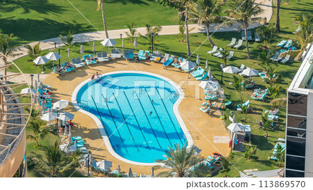 The view from skyscraper on swimming pools timelapse, Dubai, UAE The view from skyscraper on swimming pools timelapse, Dubai, UAE 113869570