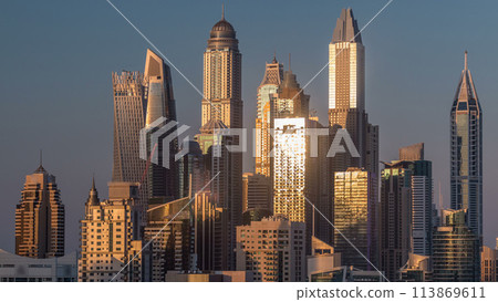 Dubai Marina towers during sunset aerial timelapse, United Arab Emirates 113869611