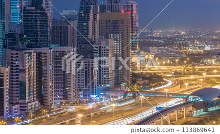 Dubai Marina skyscrapers aerial top view before sunrise from JLT in Dubai night to day timelapse, UAE. Dubai Marina skyscrapers aerial top view before sunrise from JLT in Dubai night to day timelapse, UAE. 113869641