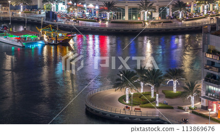 Luxury Dubai Marina canal with passing boats and promenade night timelapse, Dubai, United Arab Emirates Luxury Dubai Marina canal with passing boats and promenade night timelapse, Dubai, United Arab Emirates 113869676