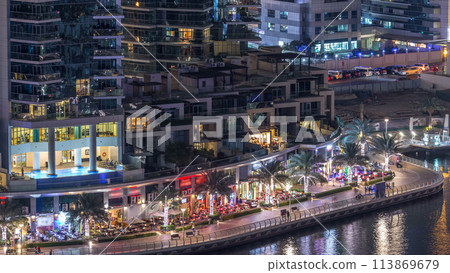 Luxury Dubai Marina canal with passing boats and promenade night timelapse, Dubai, United Arab Emirates Luxury Dubai Marina canal with passing boats and promenade night timelapse, Dubai, United Arab Emirates 113869679