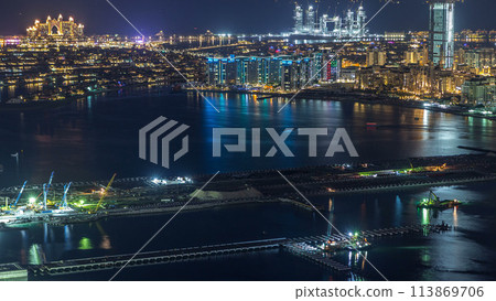 Aerial view of Palm Jumeirah Island night timelapse. Aerial view of Palm Jumeirah Island night timelapse. 113869706