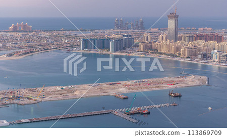 Aerial view of Palm Jumeirah Island day to night timelapse. Aerial view of Palm Jumeirah Island day to night timelapse. 113869709