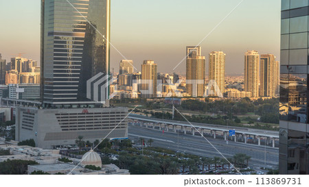Dubai cityscape showing al barsha area at sunset timelapse in united arab emirates 113869731