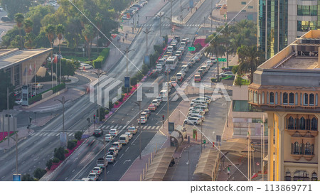 Dubai Creek area surrounded by modern buildings and busy traffic street timelapse 113869771