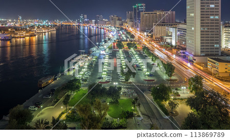 Dubai creek landscape night timelapse with boats and ship near waterfront Dubai creek landscape night timelapse with boats and ship near waterfront 113869789