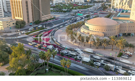 Dubai Creek area surrounded by modern buildings and busy traffic street timelapse 113869812